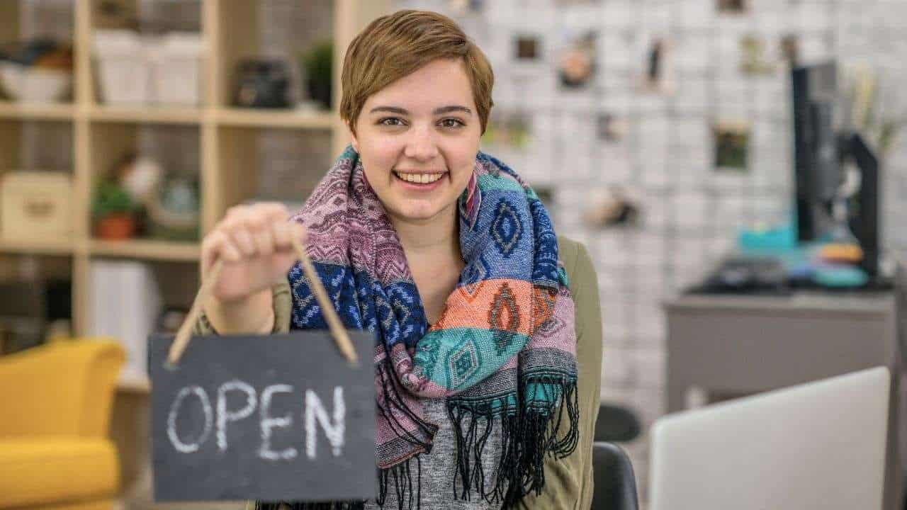 Starting a New Business? Choose One of These Best States for Starting a Business 26 woman open sign business
