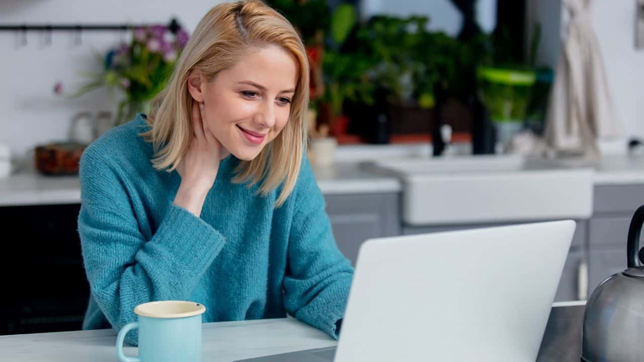 From AI-Powered Itineraries to Personalized Adventures: 12 Travel Trends Shaping 2025 6 working from home woman - Canva - Masson