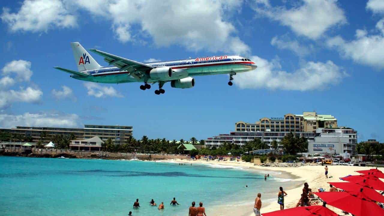 14 Lesser-Known Islands in the Caribbean That Are Pure Paradise 13 American 757 on final approach at St Maarten Airport - Todd Neville from Scottsdale, USA, CC BY 2.0 via Wikimedia Commons