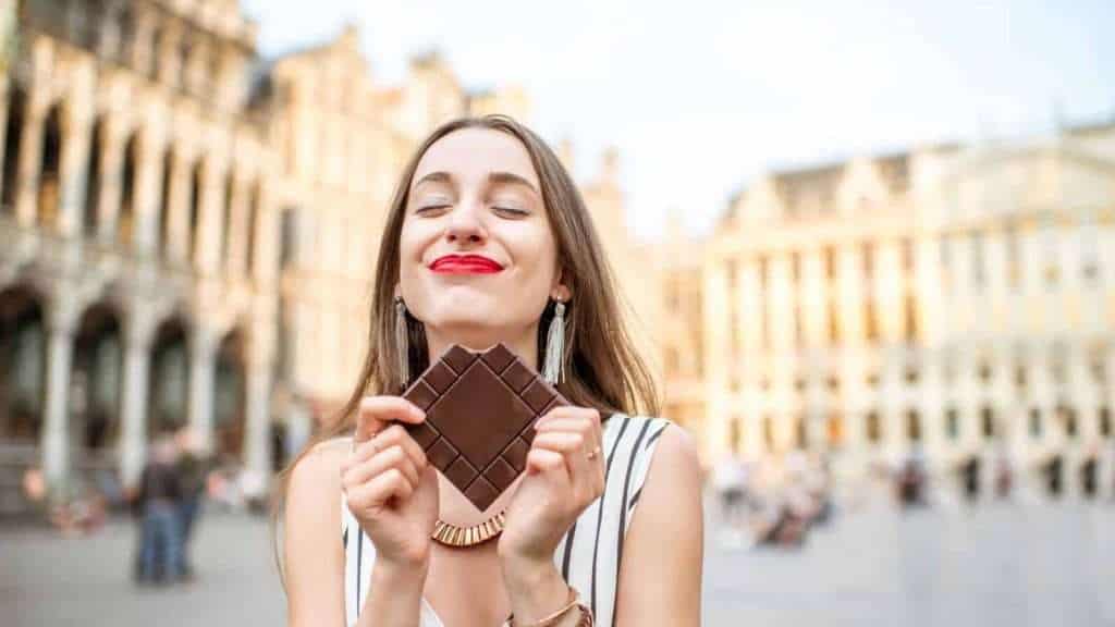 19 Best Group Travel Tours for Older Travelers 16 Delicious Destinations for Chocolate Lovers women travel eating chocolate