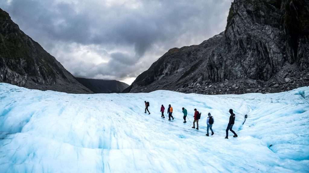 19 Best Group Travel Tours for Older Travelers 6 Franz Josef Glacier New Zealand walking travel