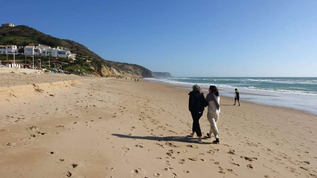 21 Hidden Coastal Getaways That Feel Like the World’s Best-Kept Secrets 5 Salema Portugal people traveling beach