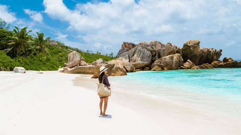 21 Remote Beaches That Will Make You Forget the Rest of the World Exists 2 Anse Cocos La Digue Seychelles women travel