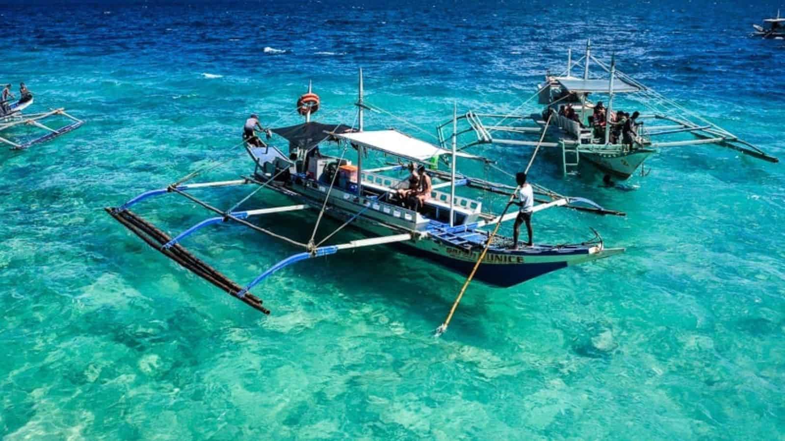 18 Group Tours That Forge Friendships Around the World 4 Island Hopping in the Philippines with Small Boats