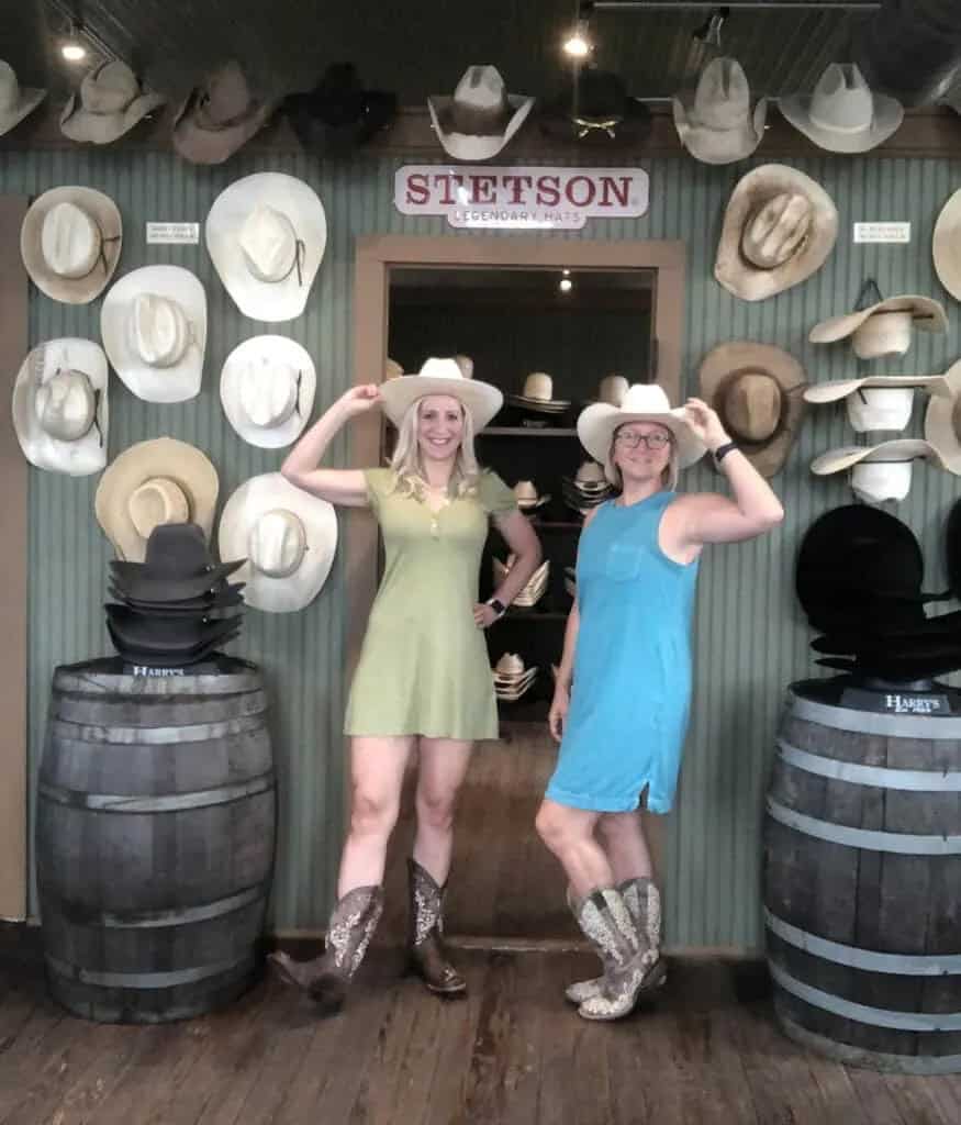 San Saba, Texas – A Fun, Small-Town Girls’ Getaway 10 women-trying-on-hats-and-boots-at-Harrys-Boots-in-San-Saba-Texas
