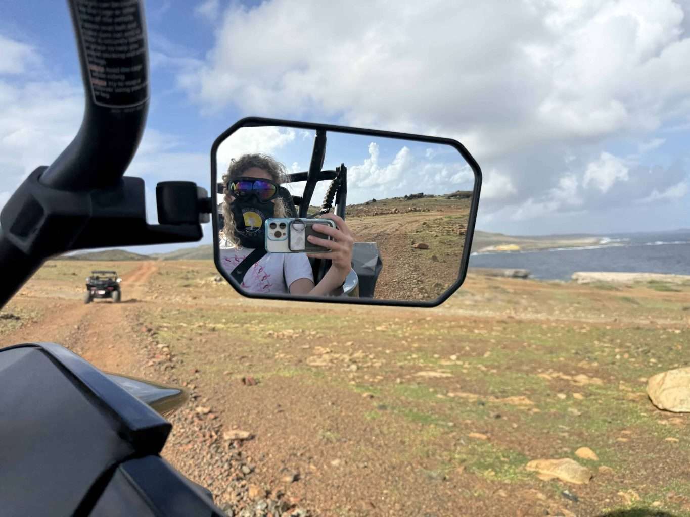 As Families Seek Meaningful Experiences and Room to Explore, These Spring Trips Go Beyond the Beach and Theme Park 7 Aruba UTV Tour Sideview Mirror - Image Credit: Rachel K Belkin.
